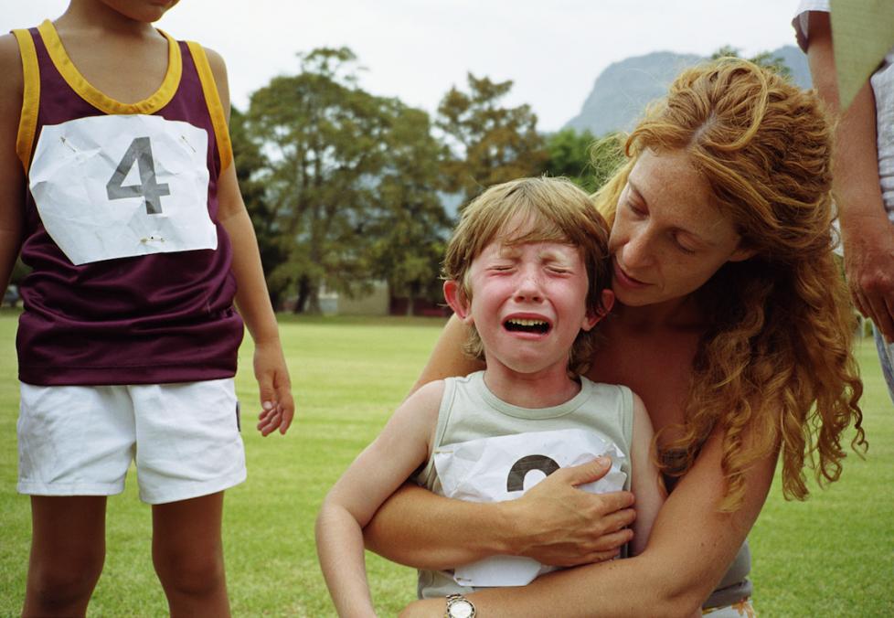 mom holding crying child