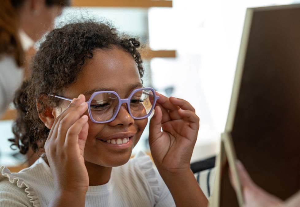 Kid trying on glasses