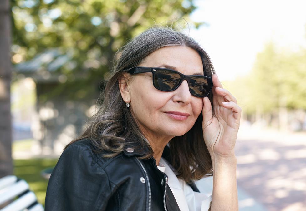 Woman trying on sunglasses