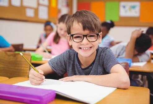 Child with glasses at school