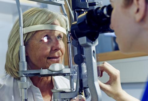 An older woman getting an eye exam