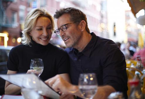 Couple looking at menu.