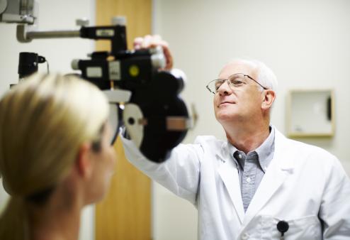 doctor giving eye exam